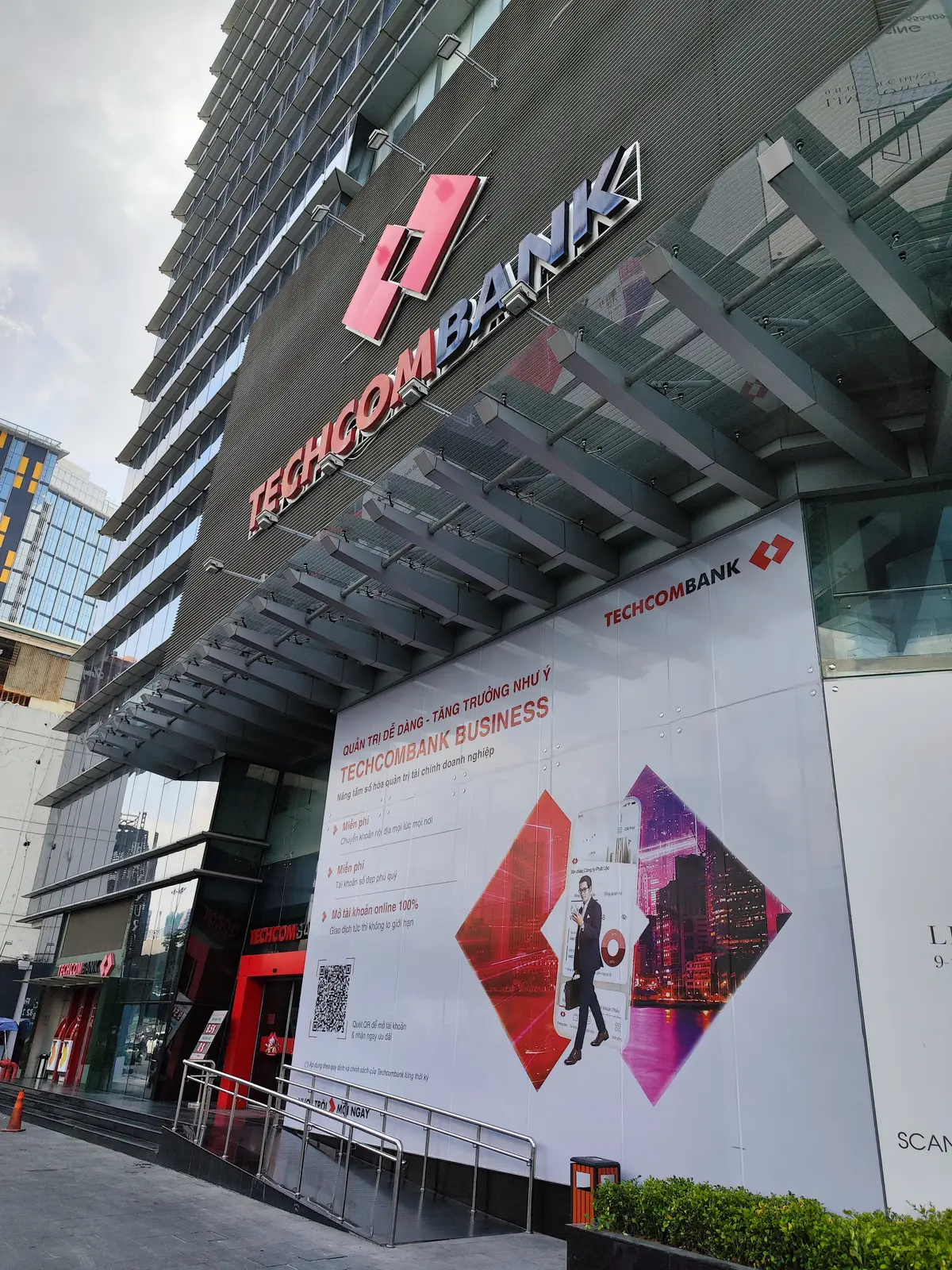 Techcombank entrance with a large red and white advertising banner above the doors.